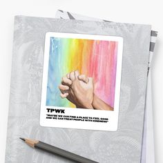 a sticker with two hands holding each other in front of a rainbow colored background