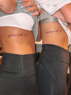 two women with tattoos on their stomachs, one has the words you love me not