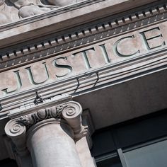 an old building with the word justice on it