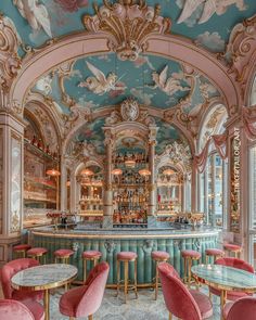 an ornately decorated bar with pink chairs and gold trimmings, painted in pastel colors