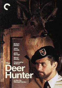 the deer hunter movie poster with a man wearing a hat and tie standing next to a deer