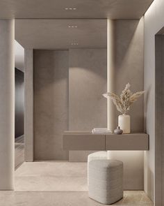 a white vase sitting on top of a counter next to a mirror and table in a room