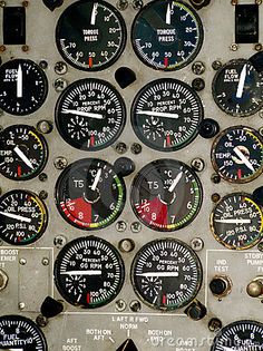 an airplane cockpit with many gauges and dials