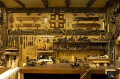 a workbench filled with lots of tools