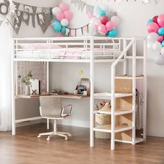 a loft bed with a desk underneath it and balloons hanging from the ceiling over it