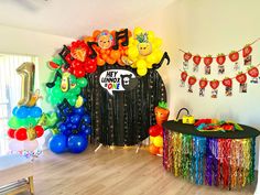 a birthday party with balloons, streamers and decorations