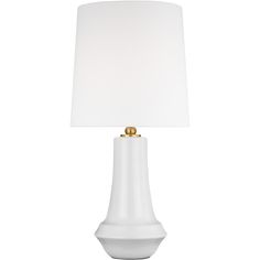 a white table lamp with a gold base