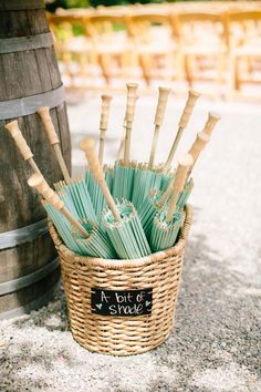 a basket filled with lots of green umbrellas