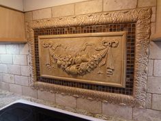 a decorative tile wall in a kitchen