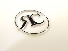 the letter r is inscribed in black on a white background with an oval logo below it