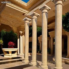 an outdoor area with columns and a fountain