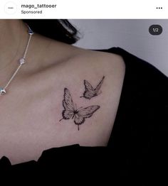 a woman's chest with two butterflies on it