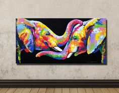 an elephant painting hanging on the wall