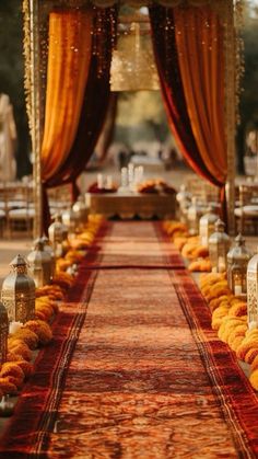 an outdoor ceremony with orange and gold decorations