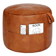 a brown leather ottoman with buttons on it