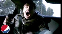 a man in the back seat of a car with his mouth open