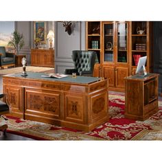 a large wooden desk sitting in the middle of a living room next to a chair