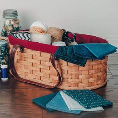 a basket filled with items on top of a wooden floor