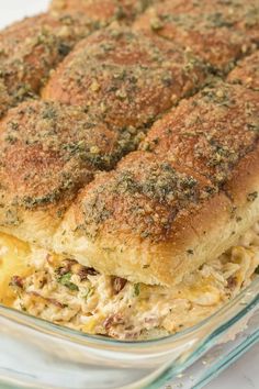 a casserole dish with meat and cheese in it on a white counter top