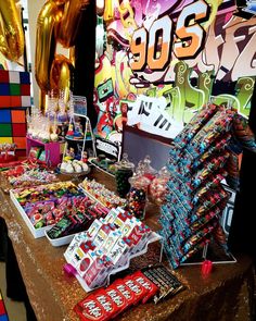 the table is full of candy and balloons