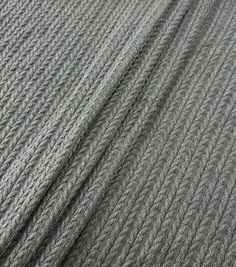 the textured fabric is grey and has been made from thick knits that are very soft