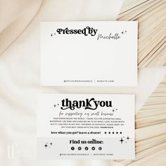 two business cards with thank you written on them