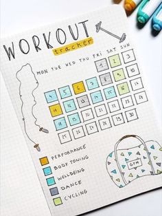 a notebook with the words workout written on it next to some markers and pencils