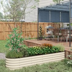 an outdoor patio with flowers and plants in the foreground, next to a wooden deck