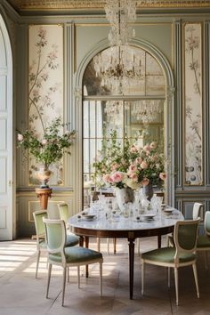 an elegant dining room with floral wallpaper and chandelier