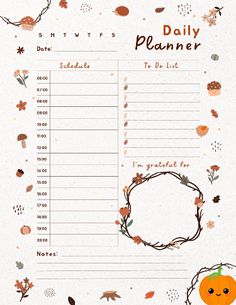 a daily planner with an owl and flowers on the front, surrounded by autumn leaves