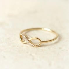 an image of a gold ring with diamonds on the bottom and in the middle that says best seller holiday sale