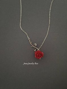 Sweet red rose and silver branch necklace. Very dainty but sturdy. Silver branch and red rose are on an 18'' stainless steel chain with lobster clasp. *Stainless steel chain *Silver brass branch *15mm resin rose *Handmade with love <3 Also available as a bracelet https://www.etsy.com/listing/665169824/silver-branch-and-red-rose-bracelet-rose?ref=shop_home_active_1 Like Jmesjewelrybox on Facebook for updates on new jewelry, upcoming sales and giveaways! Plus Facebook fans save 5% :D Find the c Red And Silver Necklace, Red Rose Necklace, Beauty And The Beast Necklace, Red Rose Jewelry, Rose Branch, Rose Accessories, Rose Jewellery, Rose Pendant Necklace, Deer Jewelry