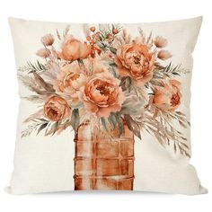 a painting of flowers in a vase on a pillow