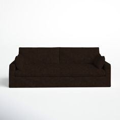 a brown couch sitting on top of a white floor