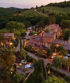 an aerial view of the estate at dusk, with umbrellas and tables in the foreground