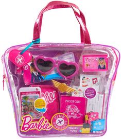 a pink bag filled with lots of toys and gadgets on top of a white surface