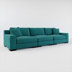 a blue couch sitting on top of a white floor