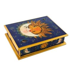 a decorative box with an image of the sun and moon on it