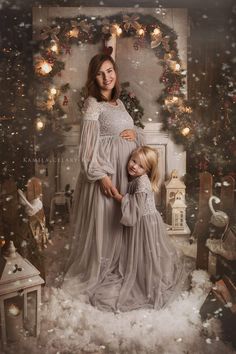 a mother and daughter pose for a christmas photo