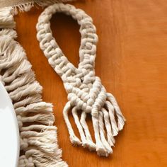 a white plate and some tassels on a table