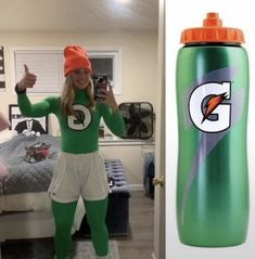 a woman in green and white outfit standing next to a bottle with the letter g on it