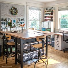 an office with lots of desks and chairs