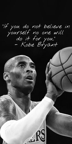 a man holding a basketball in his right hand with a quote on the back ground