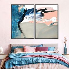 two paintings on the wall above a bed in a room with pink and blue decor