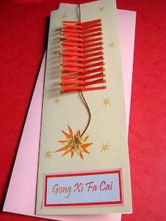 a card with a red comb on top of it