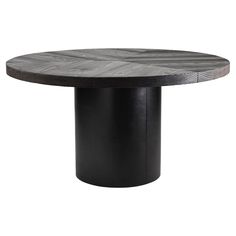 a round wooden table with black metal legs and an oval shaped base, against a white background