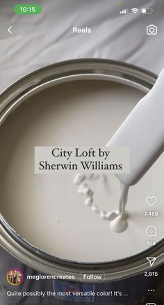 a white paint can being used as an app for the city loft by sherylin williams