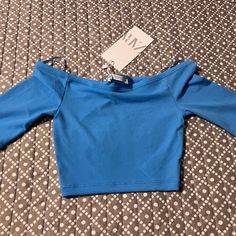 Brand New, With Tags Attached Blue Cropped Top For Women By Zara Small 5644/341 This Short Sleeved Cropped Top Is 85% Polyester And 15% Elastane. All Of My Items Come From A Smoke Free Home. I Try To The Best Of My Ability To List Items With 100% Honesty And Accuracy. Casual Blue Stretch Crop Top, Light Blue Fitted Cropped Top, Blue Fitted Casual Crop Top, Chic Blue Long Sleeve Crop Top, Blue Stretch Blouse For Spring, Fitted Light Blue Cropped Top, Trendy Fitted Blue Tops, Blue Stretch Cropped Top, Blue Fitted Trendy Crop Top