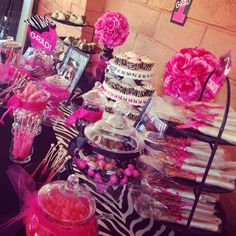 a table topped with lots of different types of desserts and candies on top of it