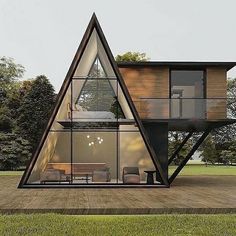 a house that is in the middle of a field with grass and trees around it